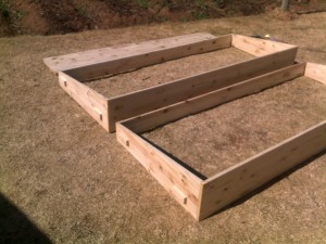 coldframe3 A few screws and some cold glue and the basic frame is completed. Note the handles made from scrap wood on the sides.
